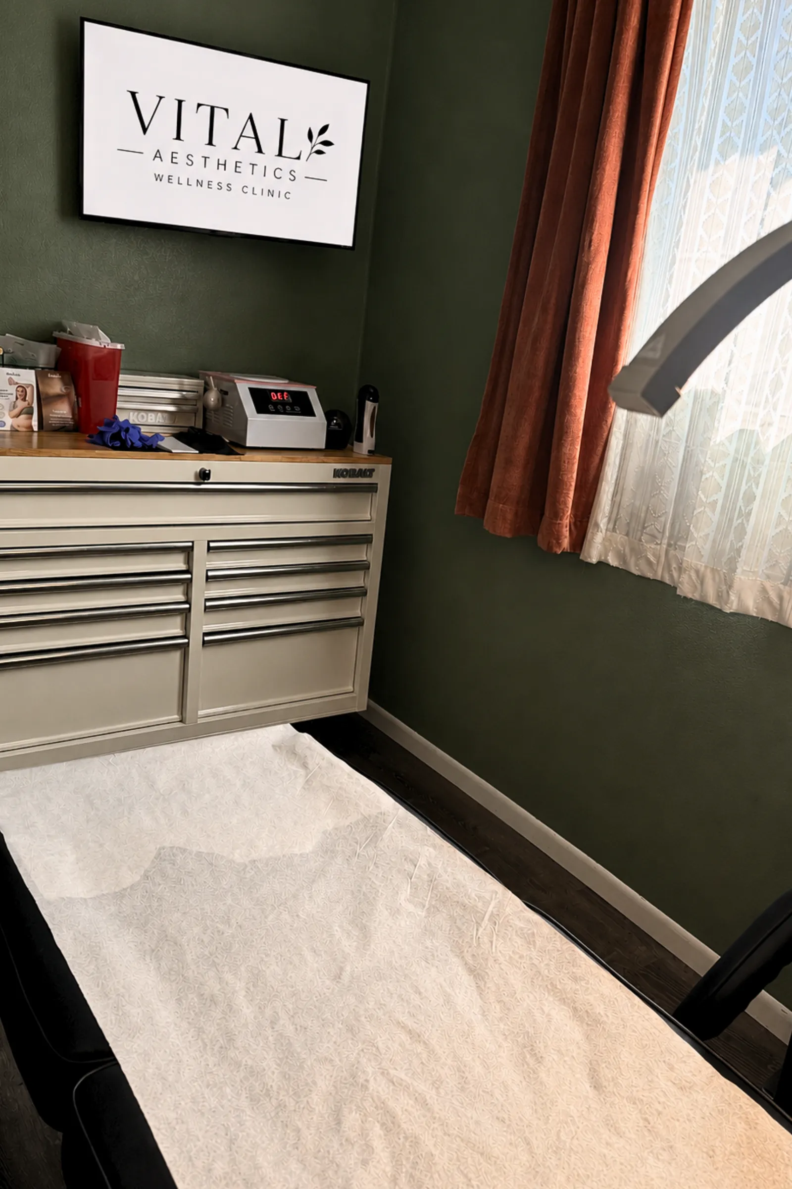 Clean luxury waxing treatment room with warm neutral linens